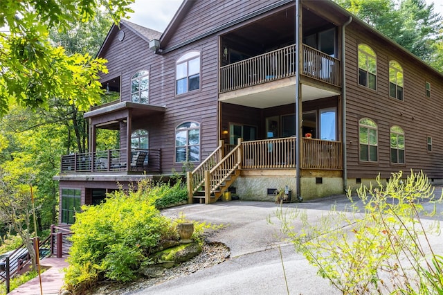 30 Lower Tanglewood Rd E Unit 1, Lake Toxaway, NC 28747 - rear view of house with crawl space and a balcony