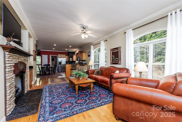 30 Lower Tanglewood Rd E Unit 1, Lake Toxaway, NC 28747 - living area with a ceiling fan, ornamental molding, wood finished floors, a fireplace, and recessed lighting
