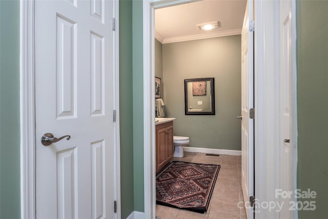30 Lower Tanglewood Rd E Unit 1, Lake Toxaway, NC 28747 - bathroom with vanity, tile patterned floors, ornamental molding, baseboards, and toilet
