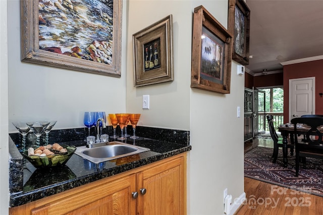 30 Lower Tanglewood Rd E Unit 1, Lake Toxaway, NC 28747 - bar with a sink, ornamental molding, and wood finished floors