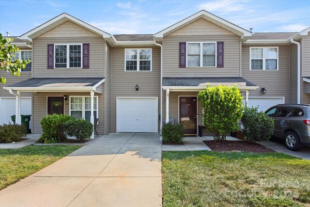 townhome / multi-family property featuring a garage