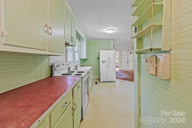 kitchen featuring premium range hood and white appliances