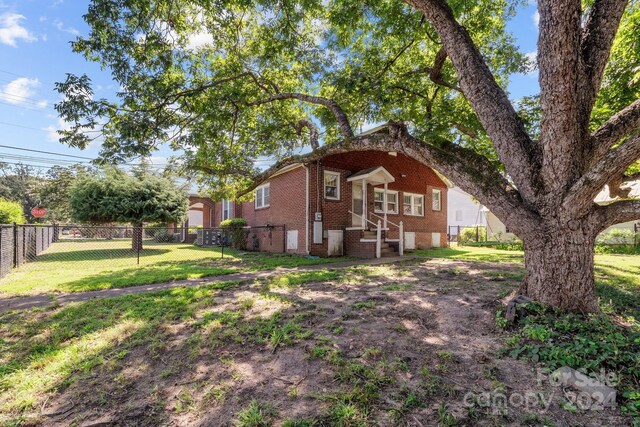 view of property exterior featuring a lawn