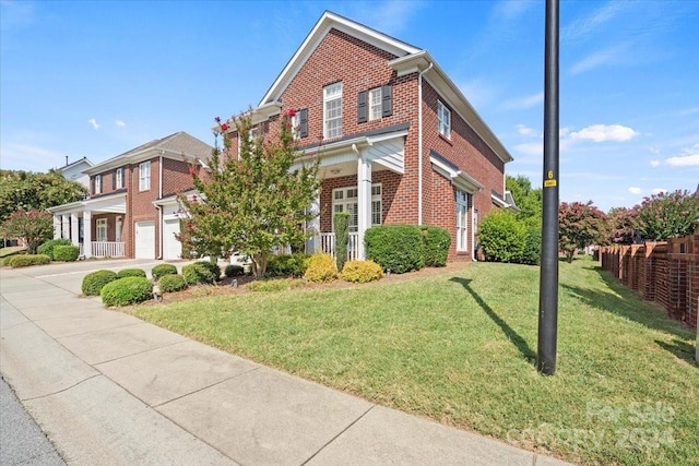 view of front of home featuring a garage and a front yard