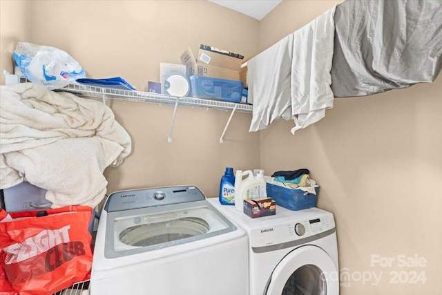 laundry area featuring washing machine and clothes dryer