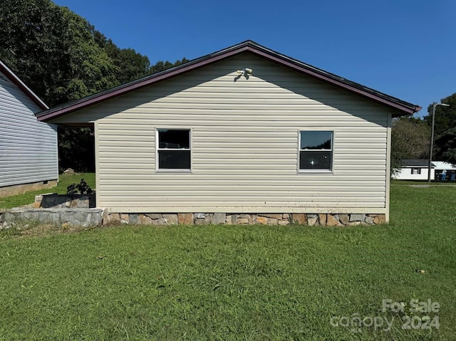 view of property exterior featuring a yard