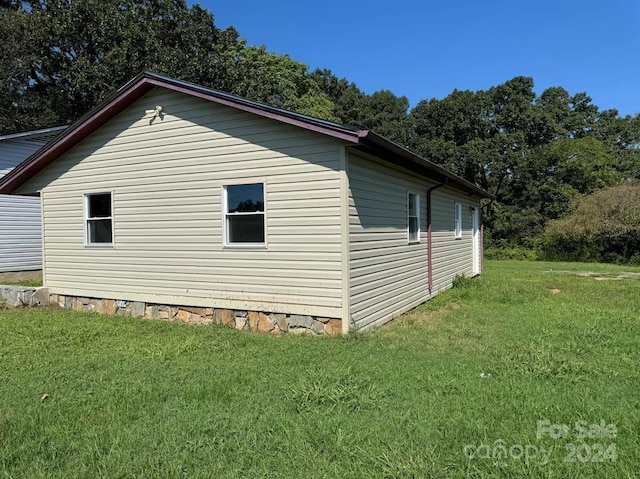 view of home's exterior featuring a yard