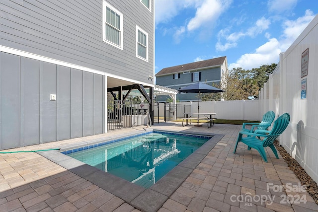 view of pool with a patio area