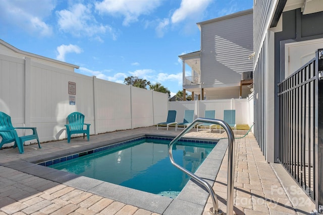 view of swimming pool featuring a patio