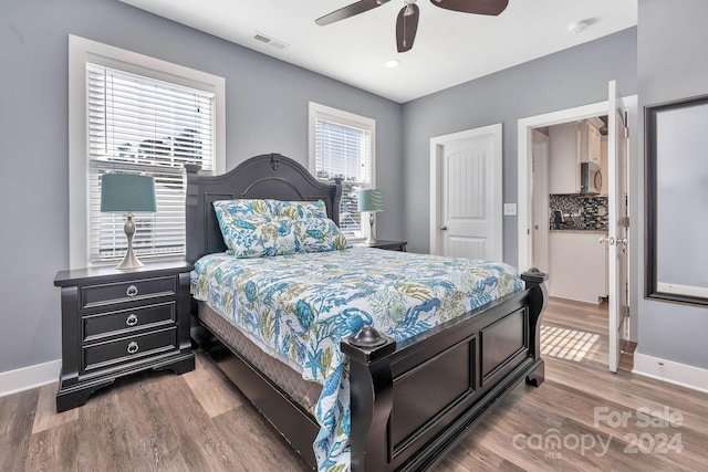 bedroom featuring ceiling fan and hardwood / wood-style floors