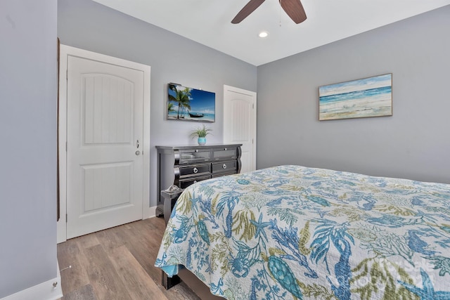 bedroom featuring light wood-type flooring and ceiling fan