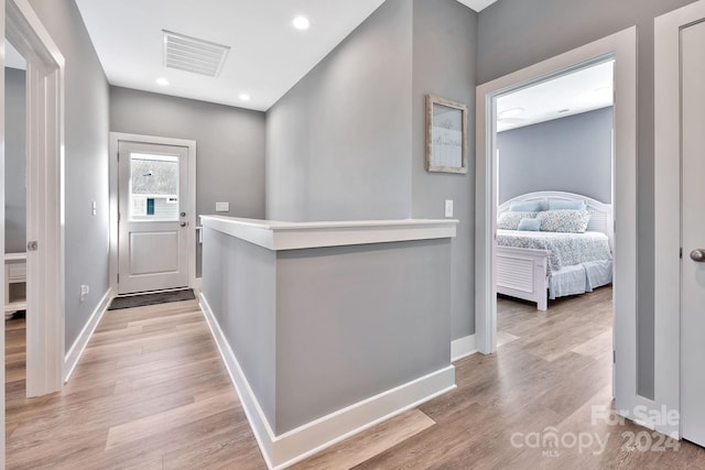 corridor featuring light hardwood / wood-style flooring