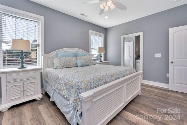 bedroom with dark wood-type flooring and ceiling fan