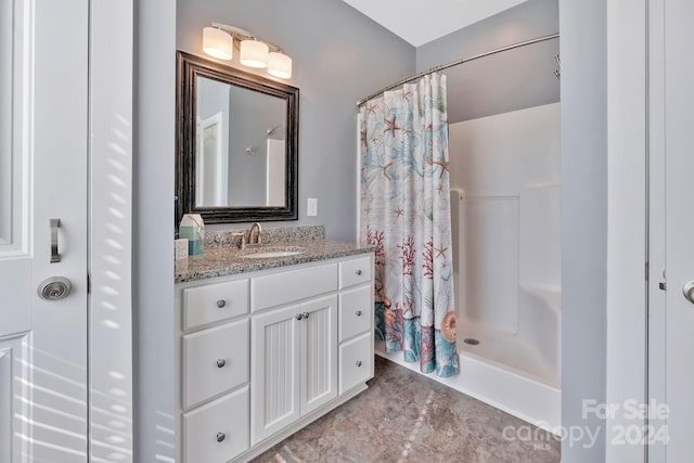 bathroom featuring vanity and walk in shower