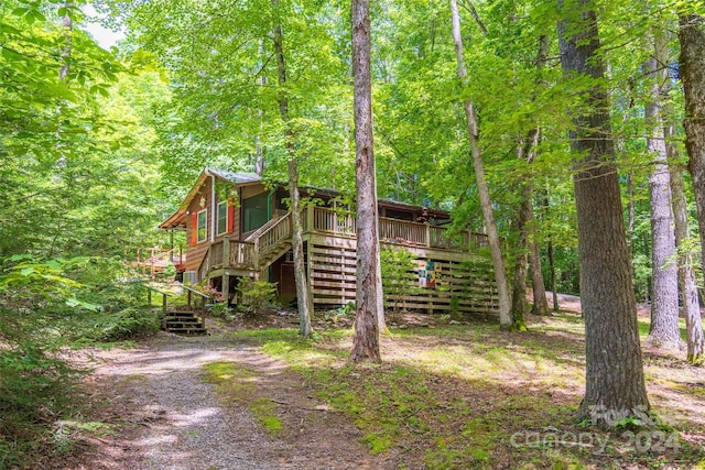 78 Smiling Fox Trl, Brevard, NC 28712 - view of front of property featuring stairs, a wooden deck, and a wooded view