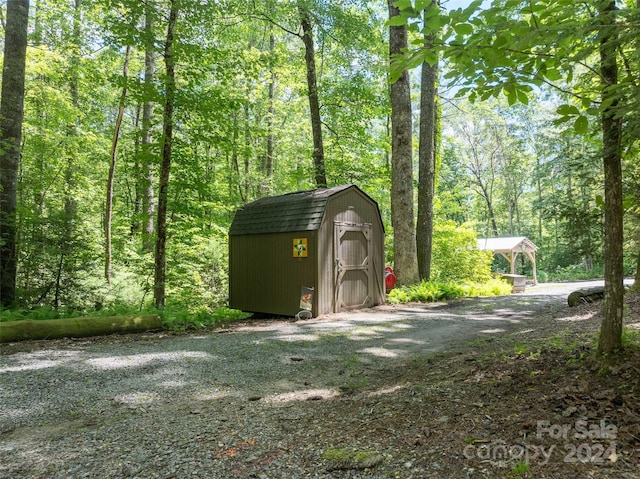 78 Smiling Fox Trl, Brevard, NC 28712 - view of shed with a forest view