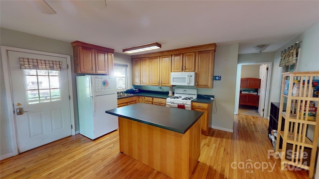 78 Smiling Fox Trl, Brevard, NC 28712 - kitchen with white appliances, light wood finished floors, dark countertops, and a kitchen island