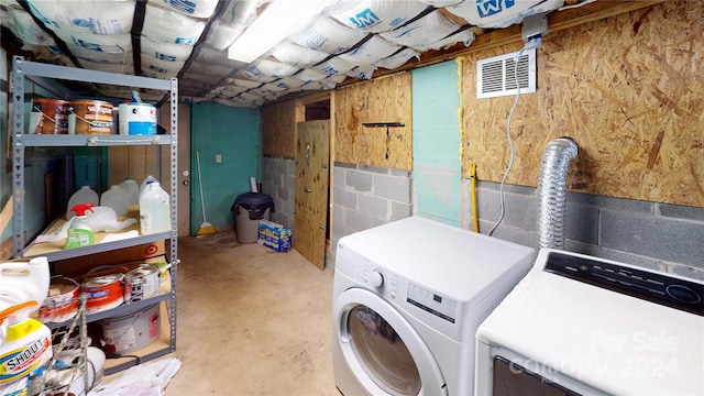 78 Smiling Fox Trl, Brevard, NC 28712 - laundry room with washing machine and clothes dryer and concrete block wall