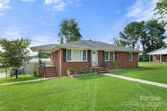 ranch-style house with a front lawn