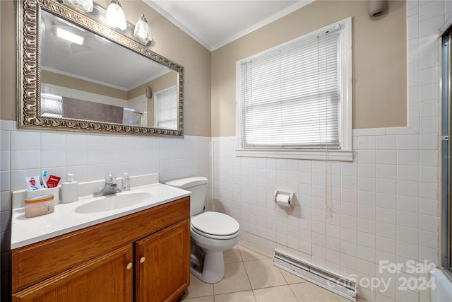 bathroom with tile patterned floors, vanity, tile walls, toilet, and a shower with door