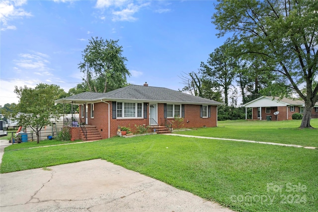 single story home with a front yard