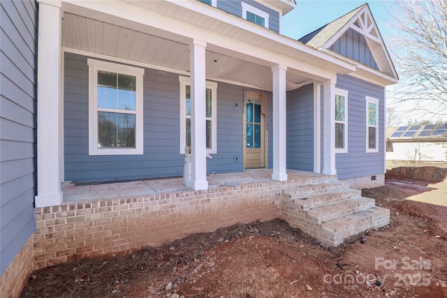 doorway to property with covered porch