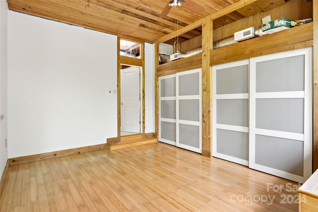 spare room with wood ceiling, ceiling fan, and light wood-type flooring