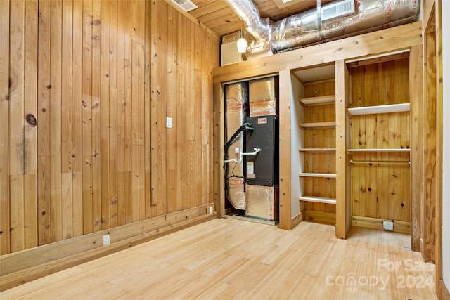 interior space with wood ceiling and hardwood / wood-style flooring