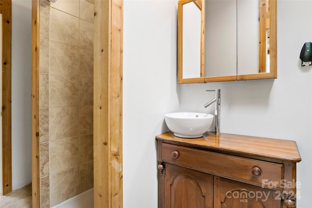 bathroom featuring tile patterned flooring and vanity