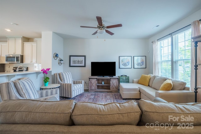 living room featuring ceiling fan