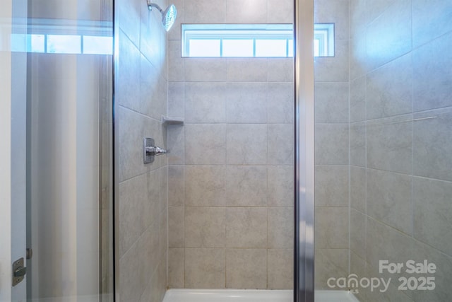 bathroom featuring an enclosed shower