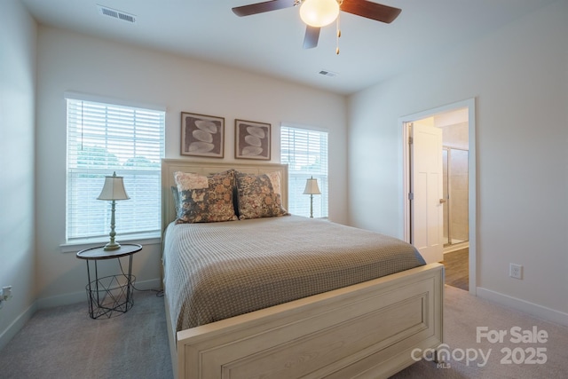 bedroom with carpet flooring, ceiling fan, and connected bathroom