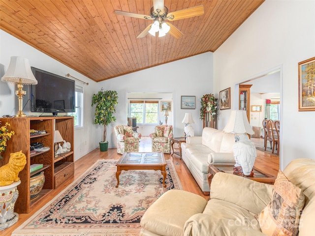 living room featuring lofted ceiling, light hardwood / wood-style floors, ceiling fan, and wooden ceiling