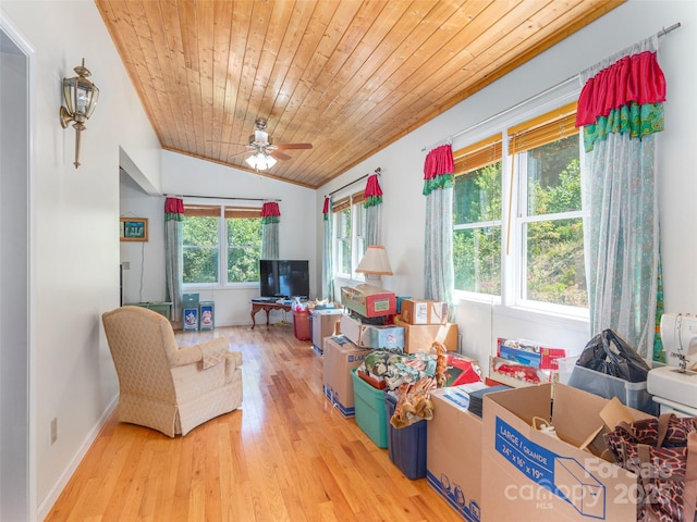 living room with ceiling fan, light hardwood / wood-style floors, wooden ceiling, and vaulted ceiling