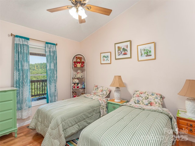 bedroom with access to exterior, ceiling fan, light hardwood / wood-style flooring, and lofted ceiling