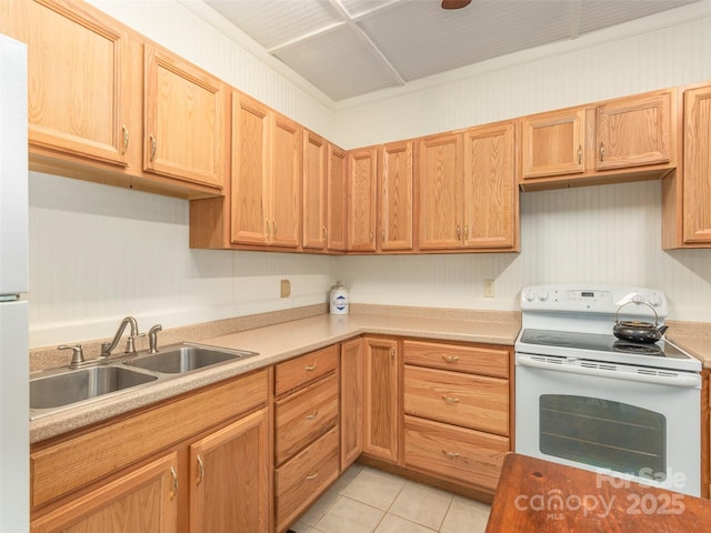 kitchen featuring light tile patterned floors, white electric stove, and sink