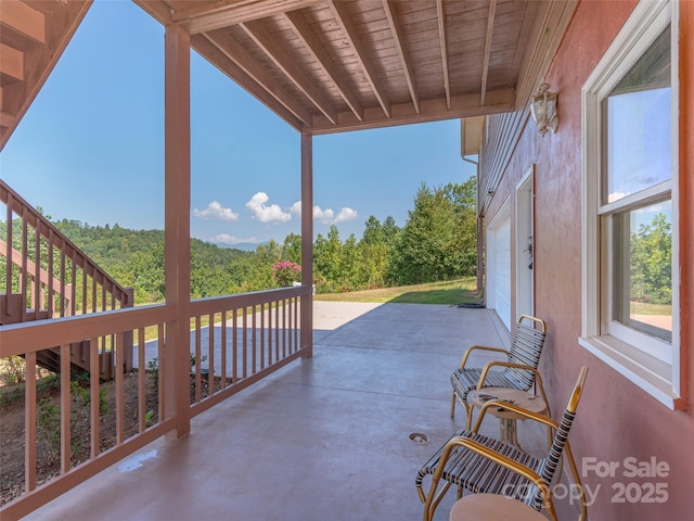 view of patio / terrace featuring a garage