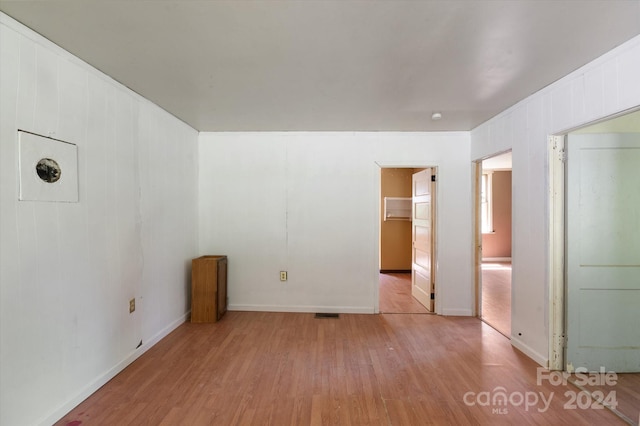 unfurnished room with light hardwood / wood-style floors