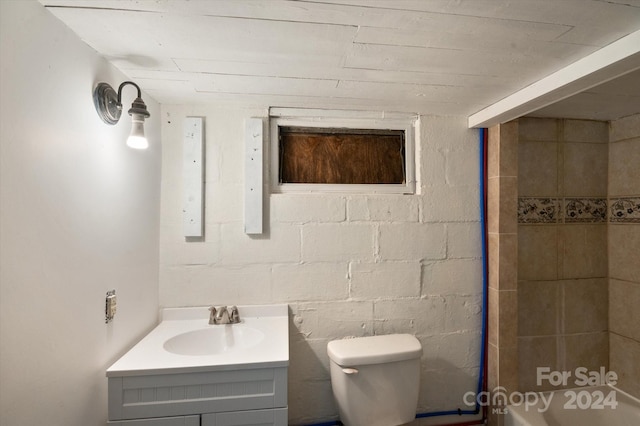 bathroom with toilet and vanity