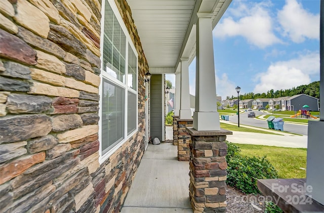 view of patio featuring a residential view and a porch