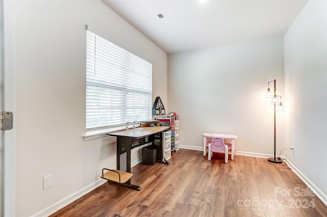 game room featuring light wood-style floors and baseboards