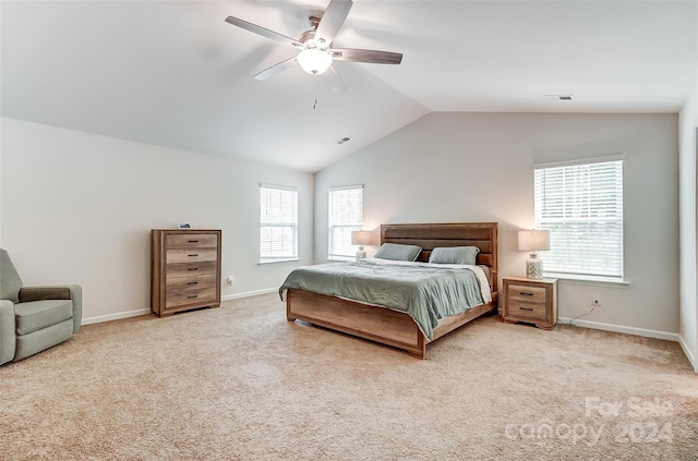 bedroom with lofted ceiling, carpet flooring, visible vents, and baseboards