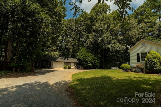 exterior space with a front lawn and a garage