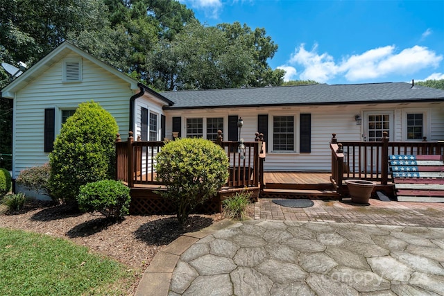 ranch-style home with a deck