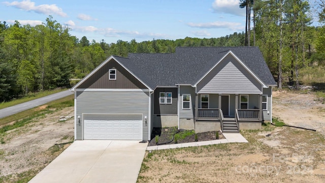 view of front of house featuring a porch and a garage