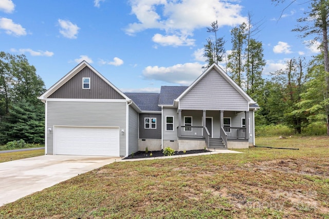 view of front of house with a garage, a front lawn, and a porch