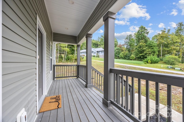 wooden terrace with a porch