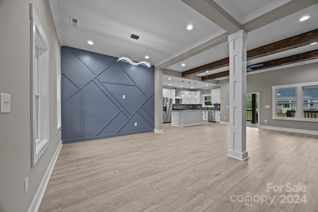 unfurnished living room featuring light wood-type flooring and beam ceiling