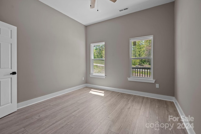 unfurnished room featuring light hardwood / wood-style floors and ceiling fan