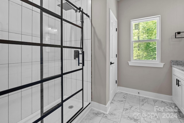 bathroom with walk in shower and vanity